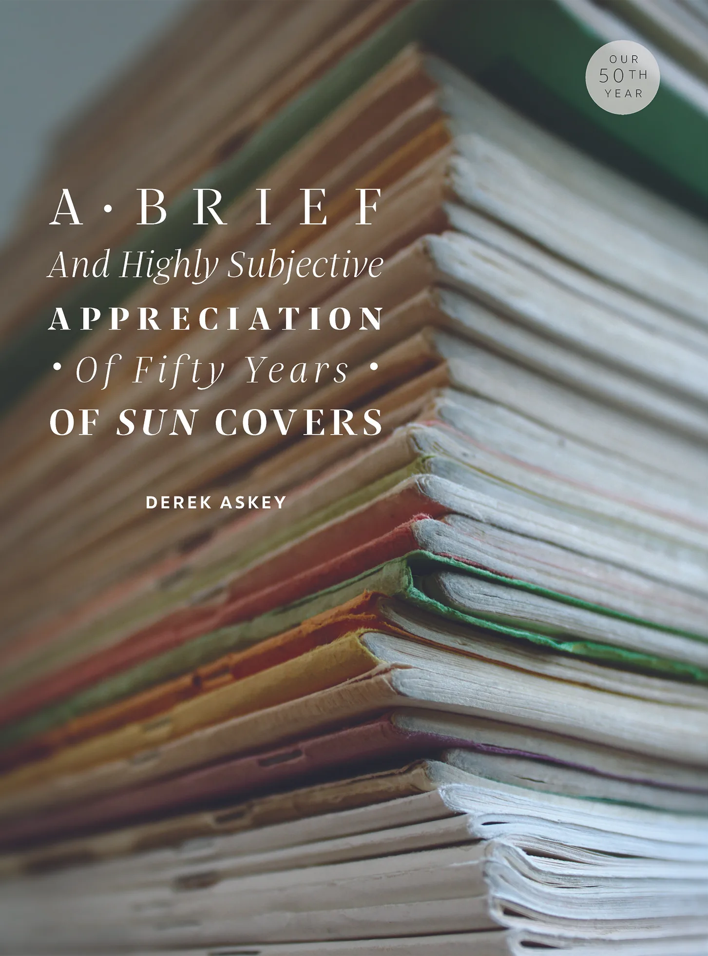 September 2023 insert cover photo. A tall stack of The Sun magazines shown from an angle capturing the bound sides and the bottoms.