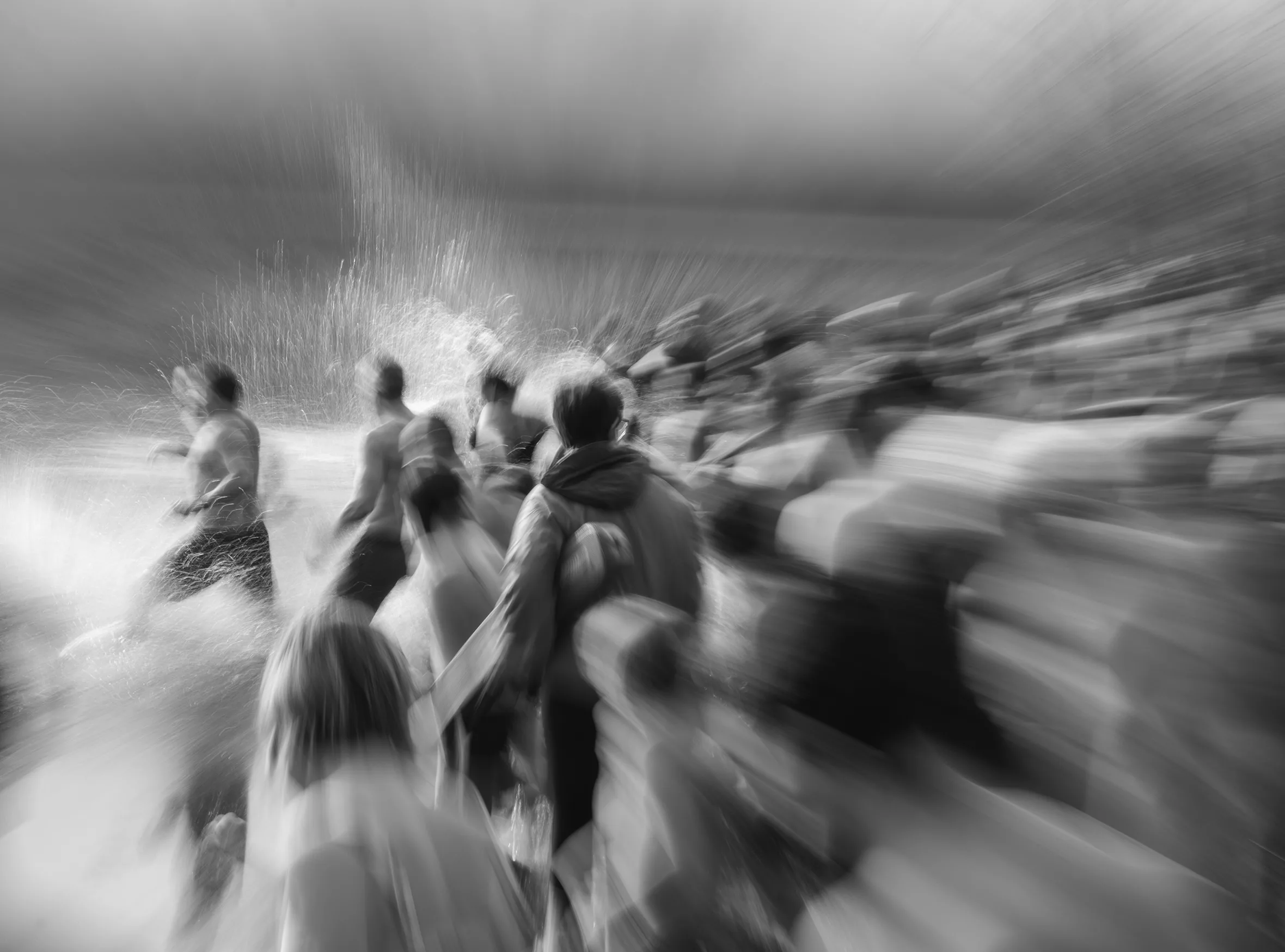 People running into the water