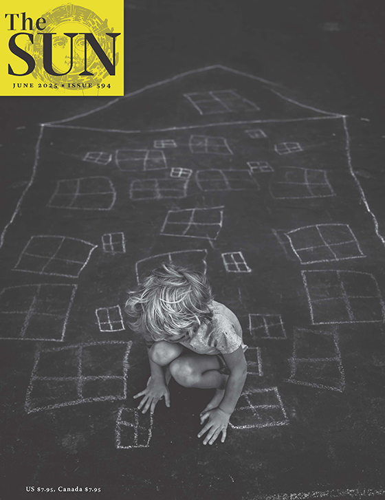 June 2025 cover of a child sitting on a pavement chalk drawing of a house