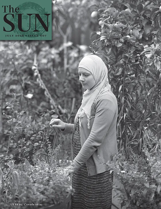 The Sun magazine July 2026 cover showing a portrait of Suzy Abu-Nie, a member of the Bay Area’s Palestinian community. Photo by Najib Joe Hakim.