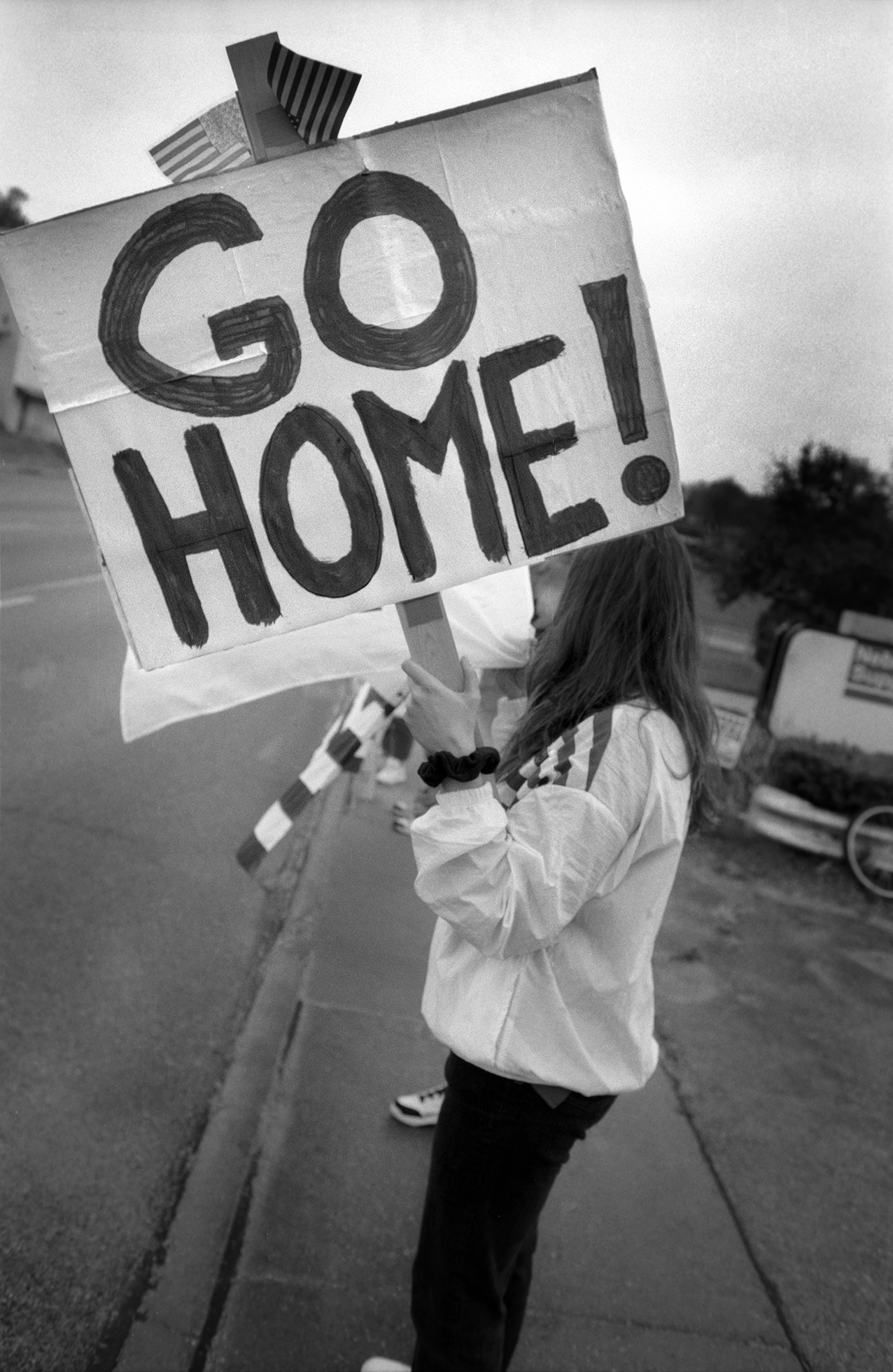 woman protesting immigrants